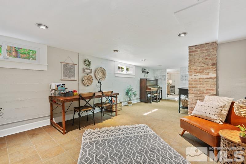 643 Manor Drive Reno, NV 89509 - Photo 22 of 37 a living room with furniture a fireplace and a table
