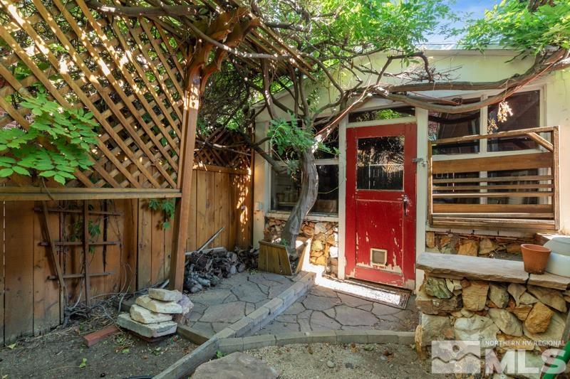 643 Manor Drive Reno, NV 89509 - Photo 35 of 37 a view of a patio with table and chairs and potted plants