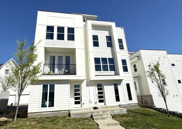 a large building with a window and balcony