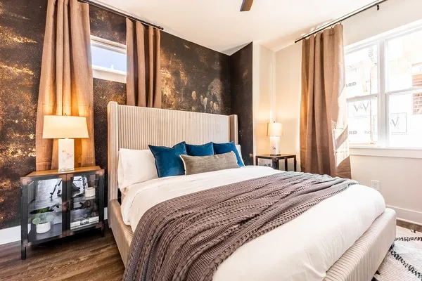 a bedroom with bed and a window