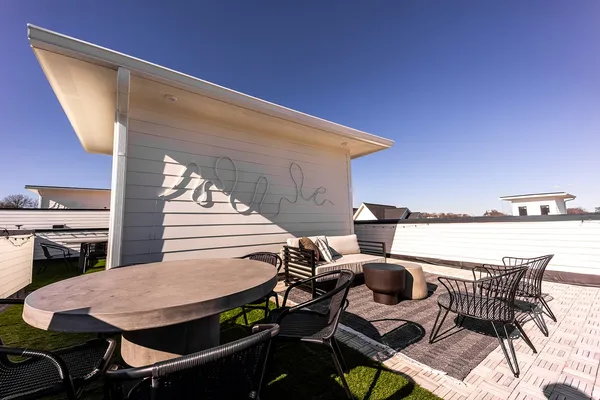 a view of a balcony with chairs