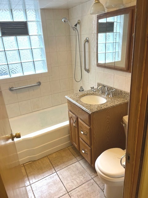 Undisclosed Address Chicago, IL 60639 - Photo 12 of 33 a bathroom with a granite countertop sink toilet mirror and bathtub