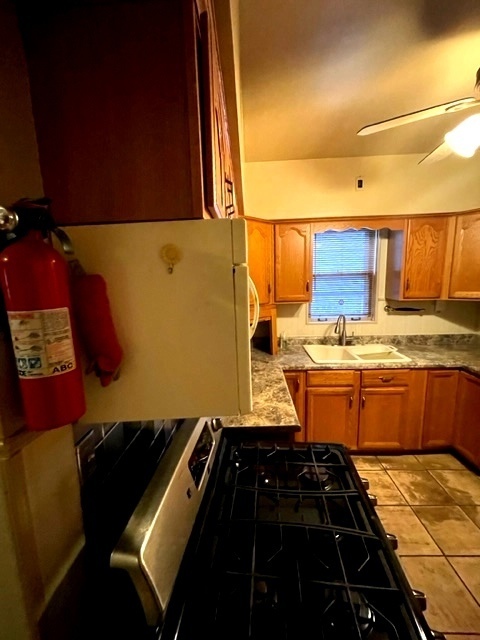 Undisclosed Address Chicago, IL 60639 - Photo 15 of 33 a kitchen with granite countertop a stove and a refrigerator