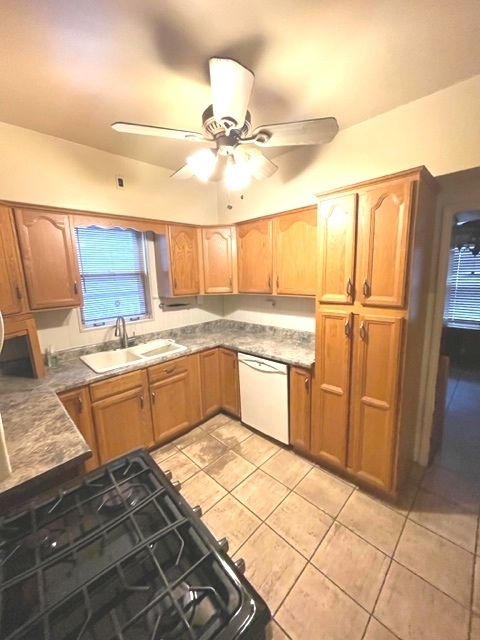 Undisclosed Address Chicago, IL 60639 - Photo 17 of 33 a kitchen with a stove a sink and a refrigerator