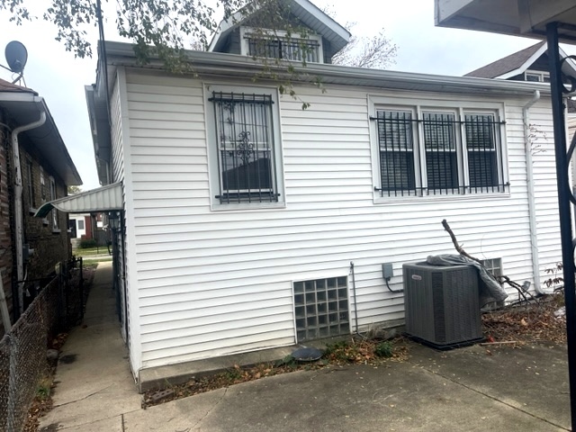 Undisclosed Address Chicago, IL 60639 - Photo 30 of 33 a view of a house with a door and a yard