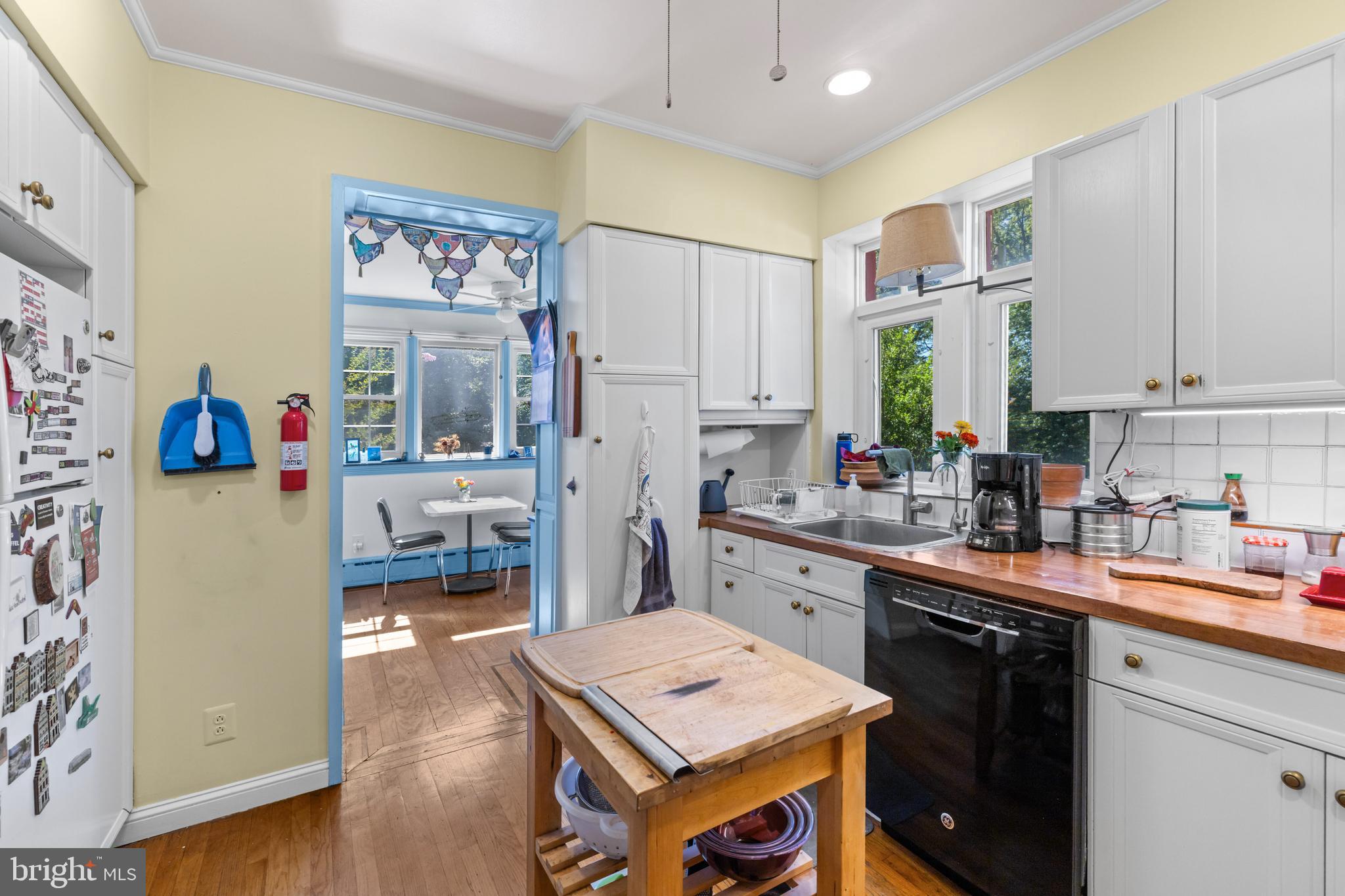 6020 Bridget Street Philadelphia, PA 19144 - Photo 14 of 43 a kitchen with a refrigerator a stove a sink dishwasher and wooden floor