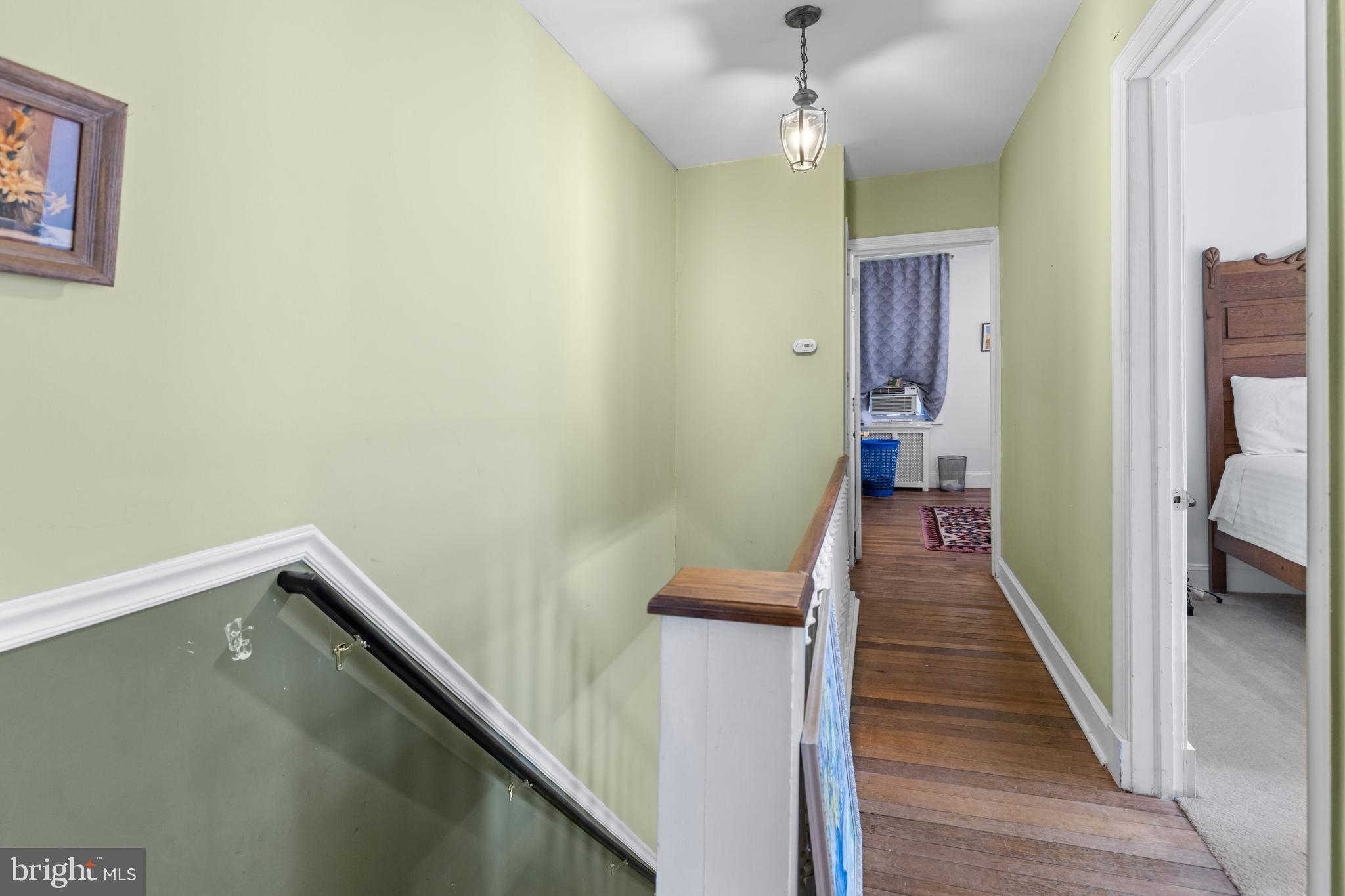 6020 Bridget Street Philadelphia, PA 19144 - Photo 17 of 43 a view of a hallway with wooden floor and staircase