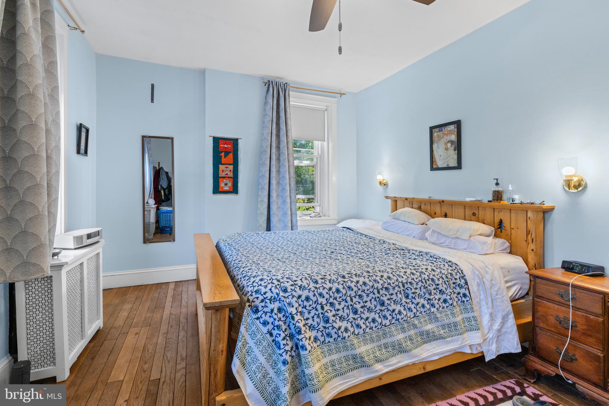 6020 Bridget Street Philadelphia, PA 19144 - Photo 24 of 43 a bedroom with a bed and wooden floor