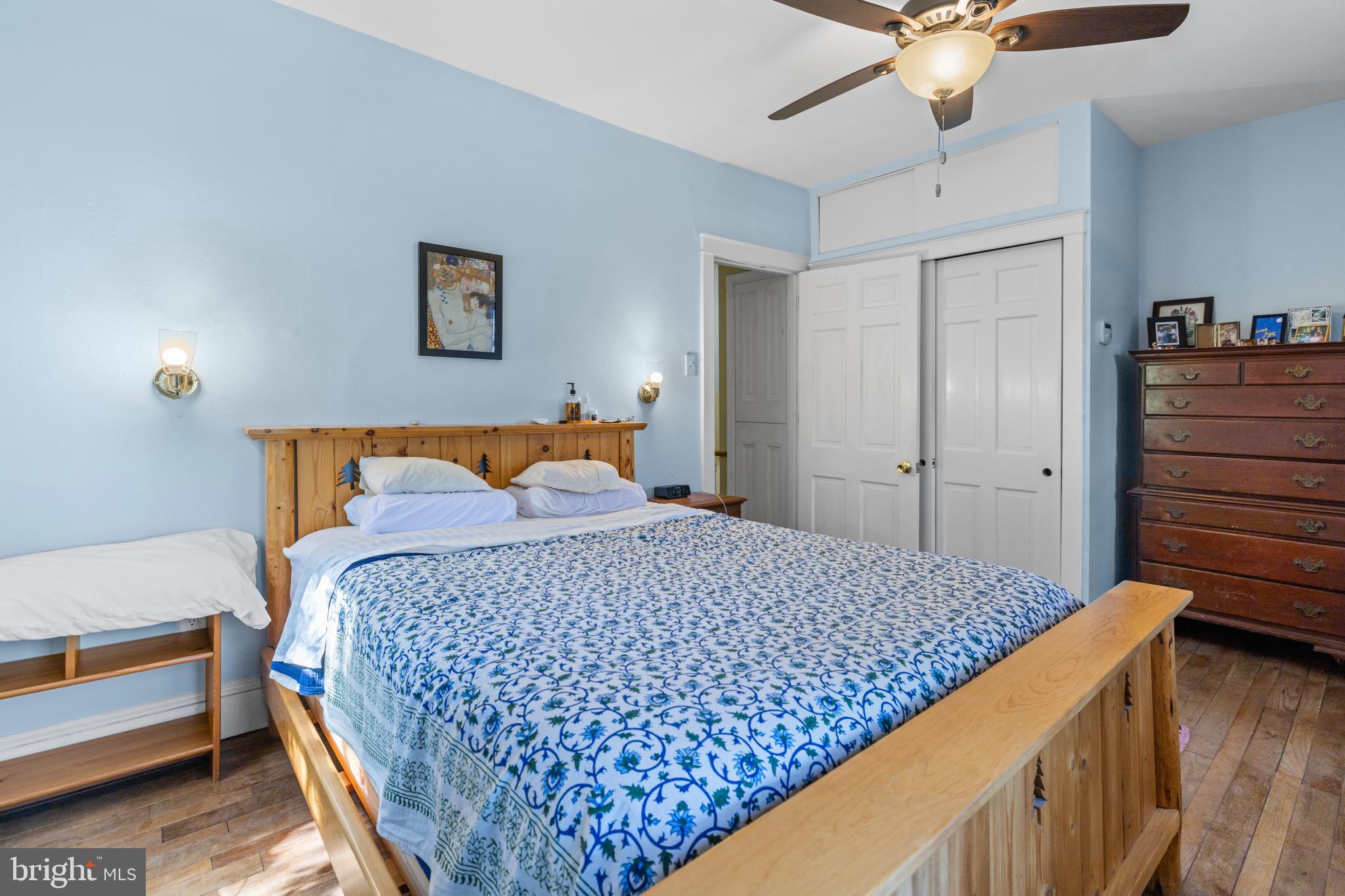 6020 Bridget Street Philadelphia, PA 19144 - Photo 25 of 43 a bedroom with a bed and a chandelier
