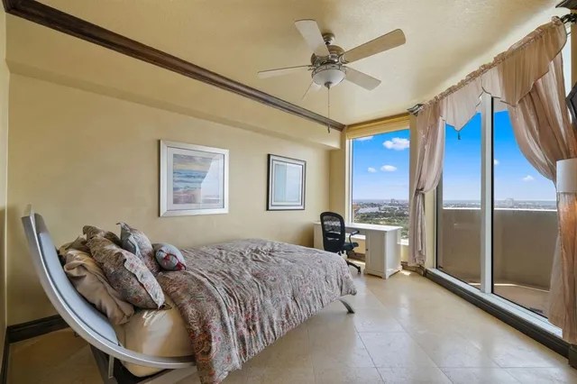 a bed room with a bed and a chandelier