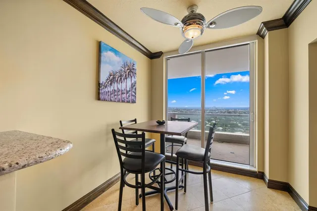 a view of a dining room with furniture window and outside view
