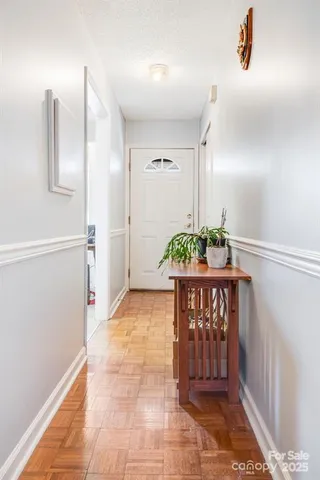 a view of a hallway with front door