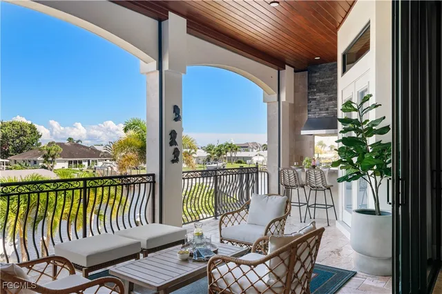 a view of a balcony with lake view and wooden floor