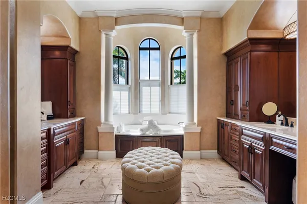 a spacious bathroom with a granite countertop sink a mirror and a shower