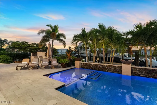 a view of outdoor space with swimming pool and lounge chair