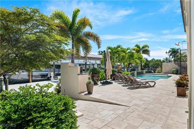 a view of a backyard with a patio