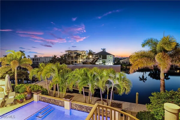 a view of swimming pool with outdoor seating and city view