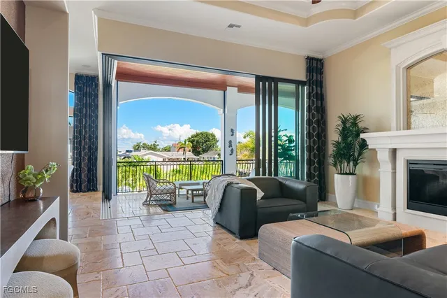 a living room with furniture and a floor to ceiling window