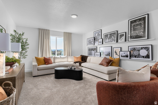 2819 South 710th West, Unit 14 Logan, UT 84321 - Photo 15 of 24 Spacious room featuring light gray carpeting, crisp white walls, and a large window with distant scenery