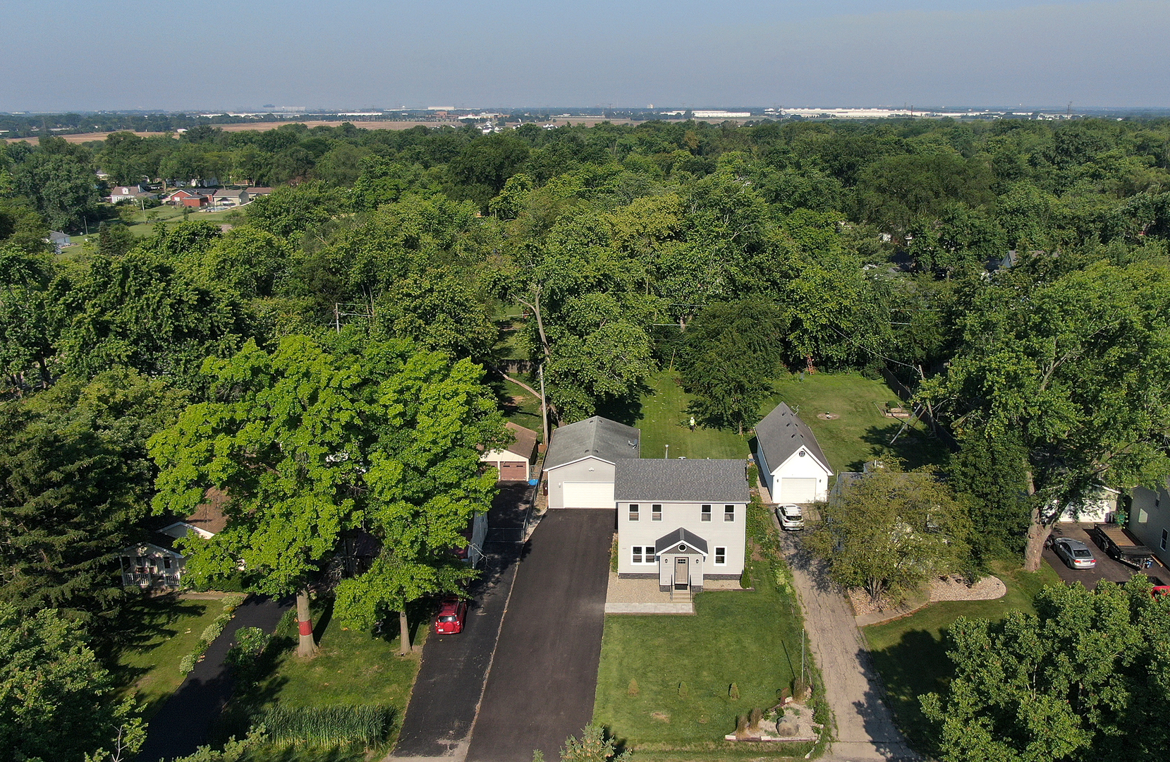 825 South Prairie Road New Lenox, IL 60451 - Photo 1 of 42 an aerial view of a house with a yard