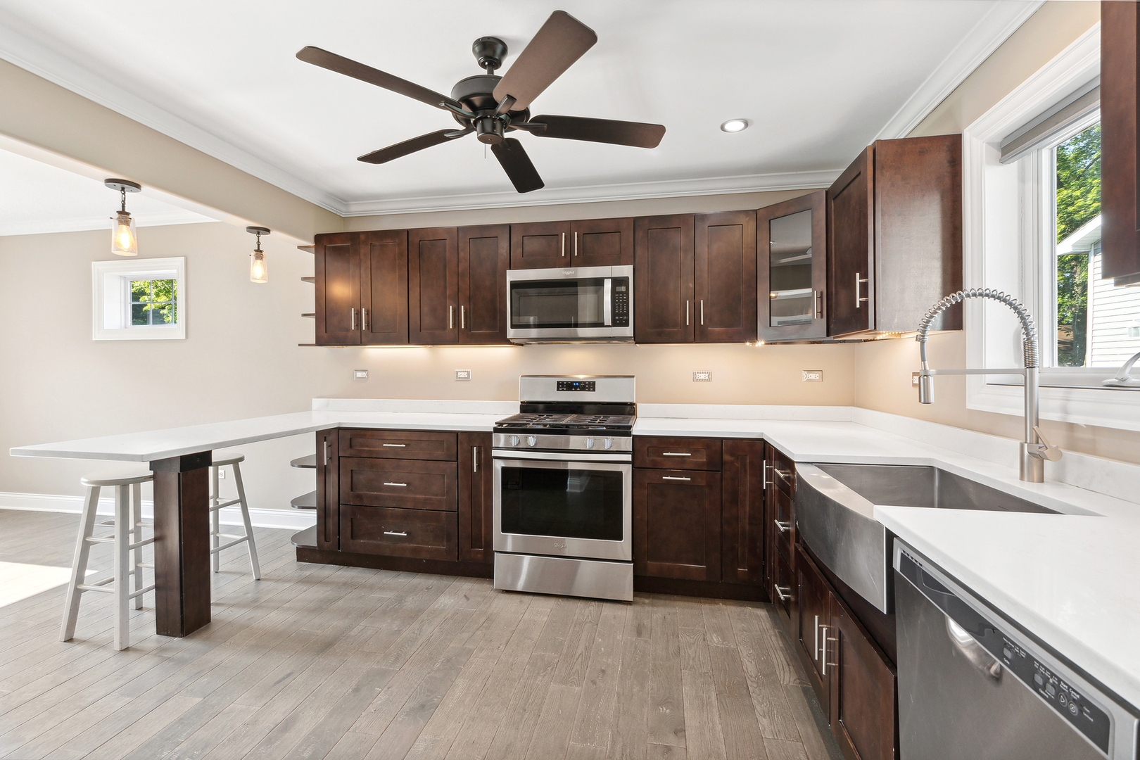 825 South Prairie Road New Lenox, IL 60451 - Photo 14 of 42 a kitchen with a stove sink and cabinets
