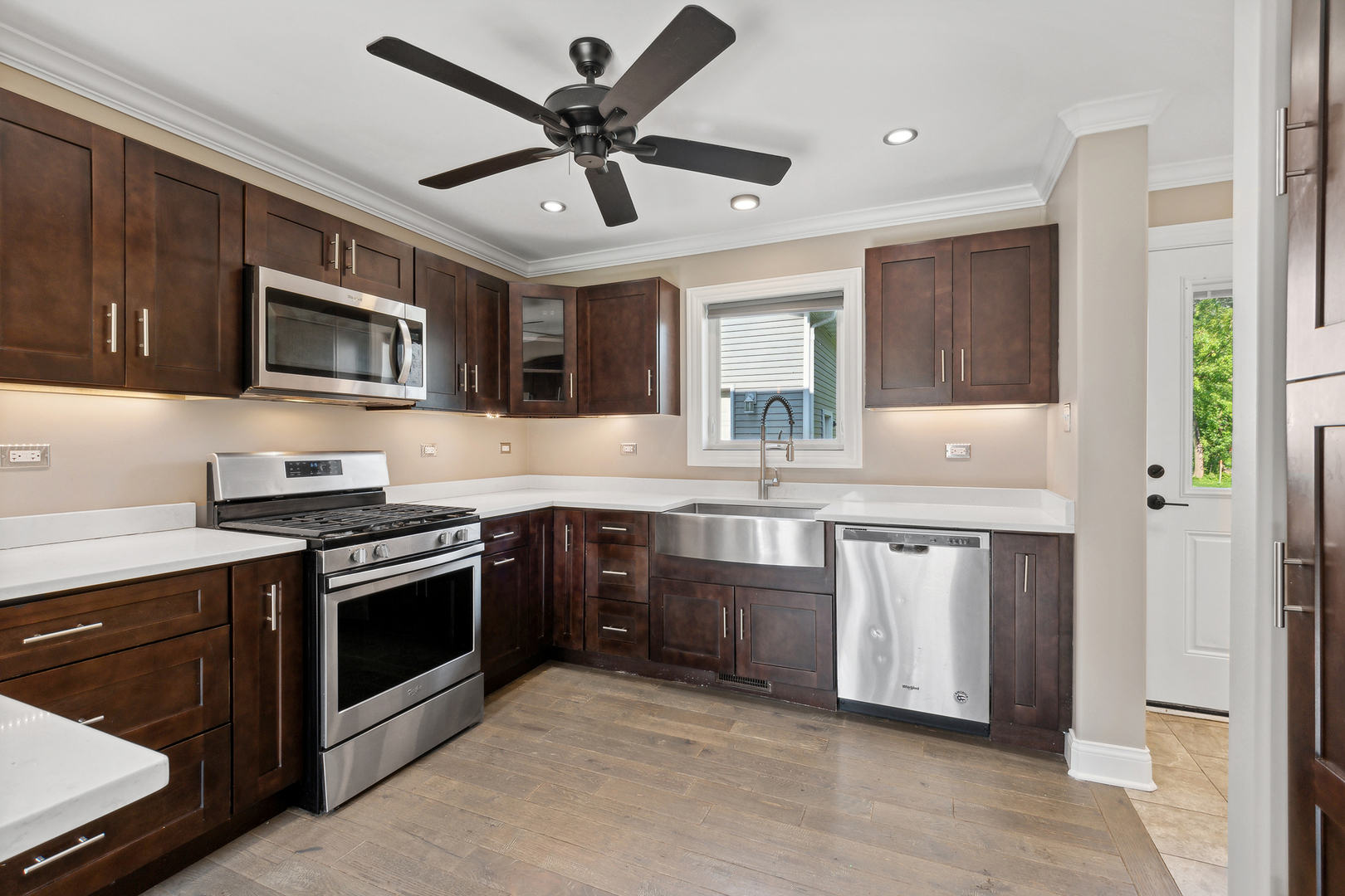 825 South Prairie Road New Lenox, IL 60451 - Photo 15 of 42 a kitchen with stainless steel appliances granite countertop a stove sink microwave and refrigerator