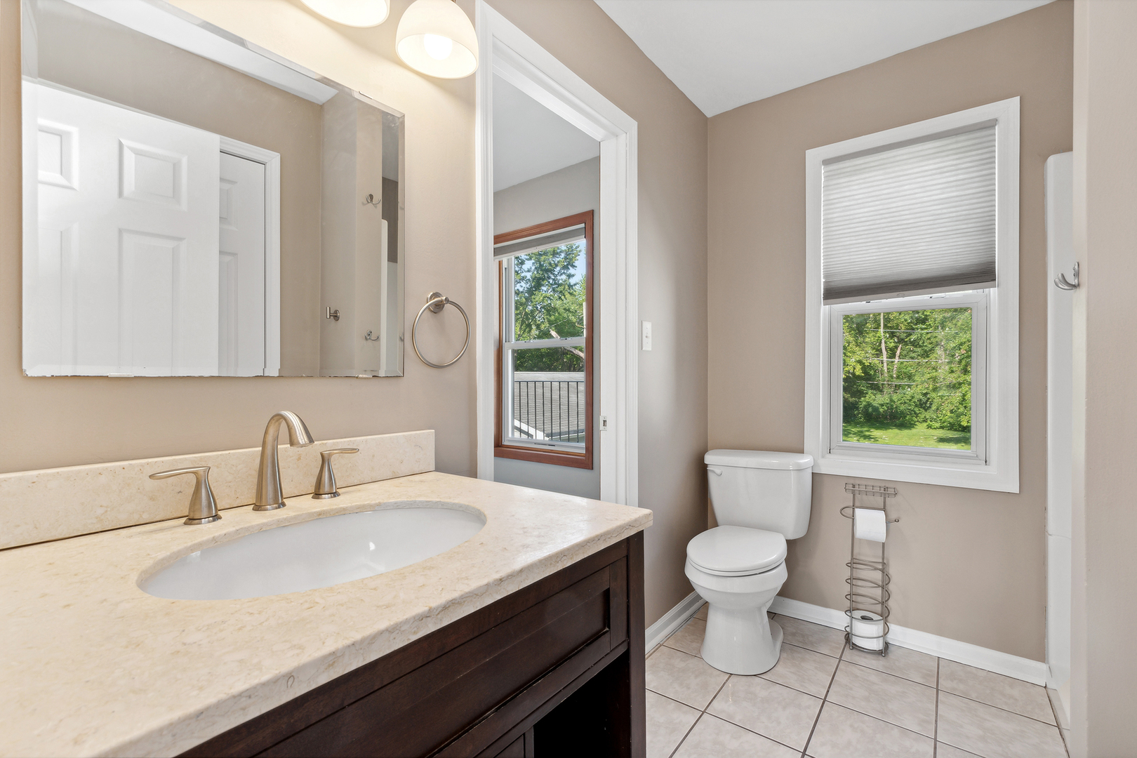 825 South Prairie Road New Lenox, IL 60451 - Photo 23 of 42 a bathroom with a granite countertop sink a toilet and a window