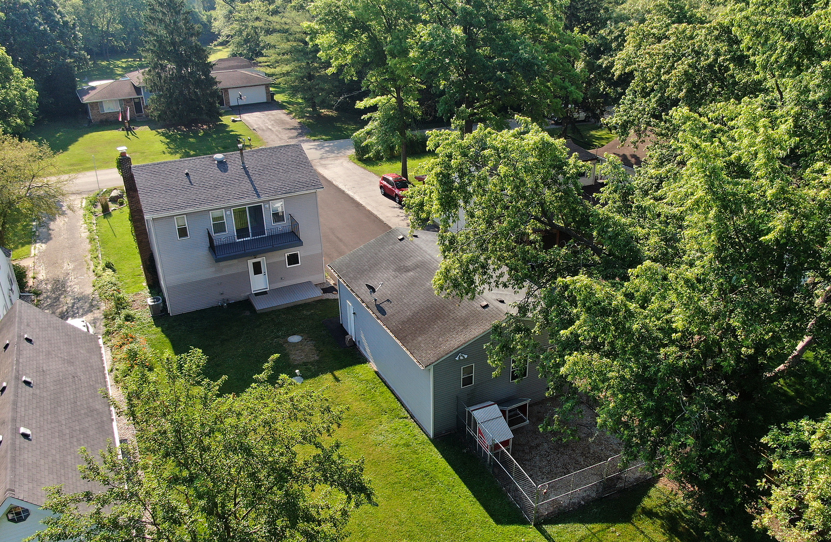 825 South Prairie Road New Lenox, IL 60451 - Photo 36 of 42 an aerial view of a house with garden space sitting space and swimming pool