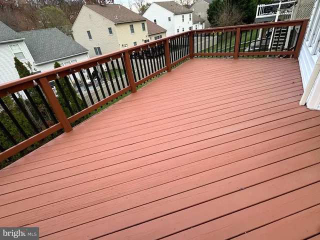 a view of backyard with a deck