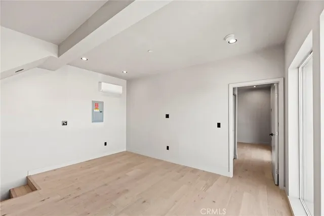 a large white kitchen with cabinets