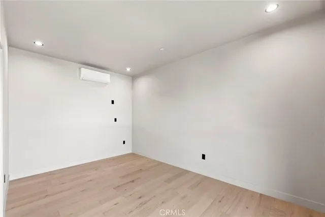 a kitchen with stainless steel appliances a sink and a refrigerator