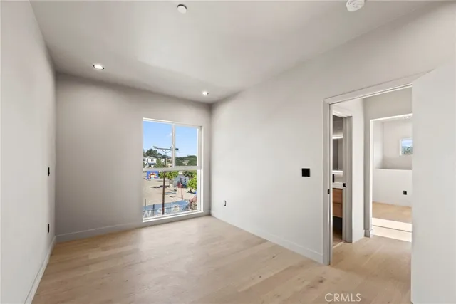 a view of empty room with a fireplace