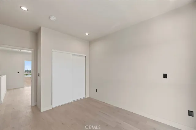 a kitchen with stainless steel appliances a refrigerator and a stove top oven