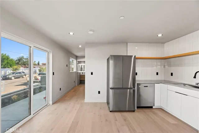 a bathroom with a sink toilet and a mirror