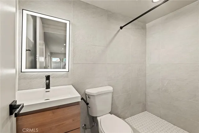 an empty room with windows and entrance