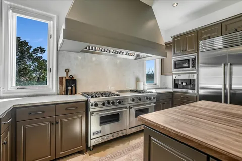 a kitchen with a stove and a microwave