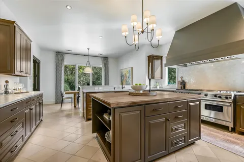 a kitchen with a stove and cabinets