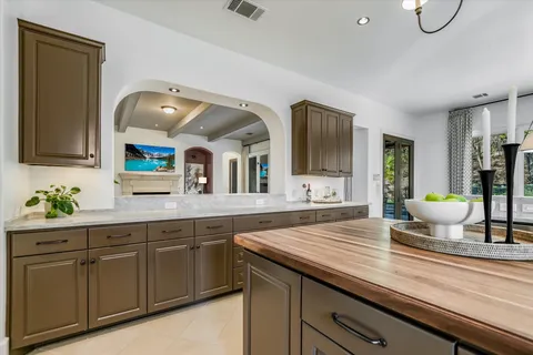 a spacious bathroom with a granite countertop sink and a mirror