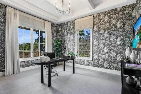 a view of a livingroom with furniture and a window