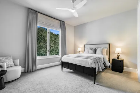 a spacious bedroom with a bed and a couch