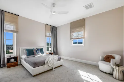 a bedroom with a bed and window