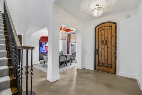 a view of an entryway with wooden floor