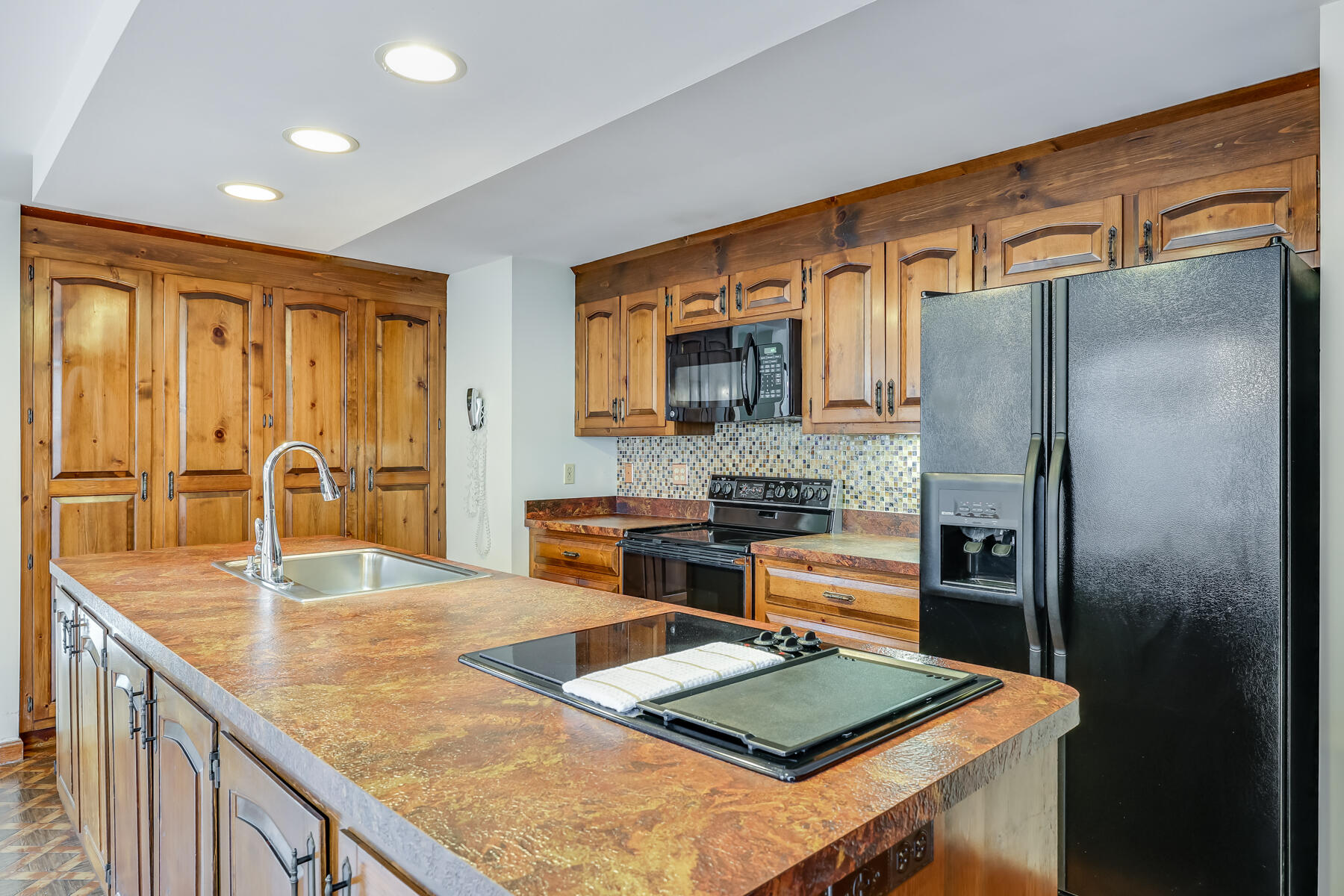11 Menemsha Way East Falmouth, MA 02536 - Photo 13 of 50 a kitchen with stainless steel appliances granite countertop refrigerator sink and stove