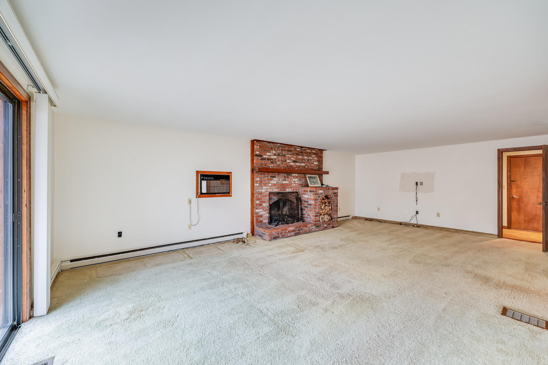 11 Menemsha Way East Falmouth, MA 02536 - Photo 14 of 50 a view of an empty room with a fireplace