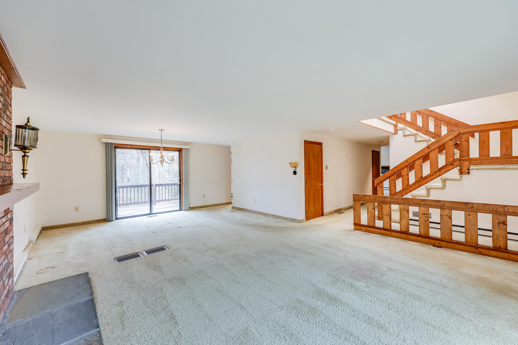 11 Menemsha Way East Falmouth, MA 02536 - Photo 17 of 50 a view of an empty room with window and stairs