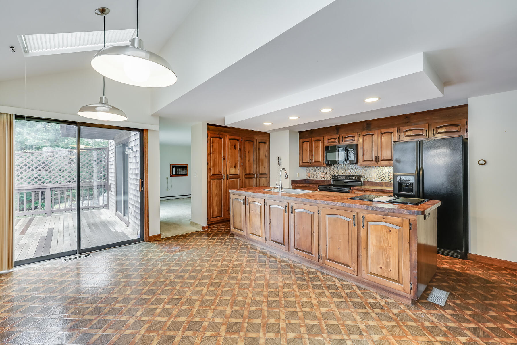 11 Menemsha Way East Falmouth, MA 02536 - Photo 21 of 50 a large kitchen with stainless steel appliances kitchen island granite countertop a refrigerator and a stove top oven
