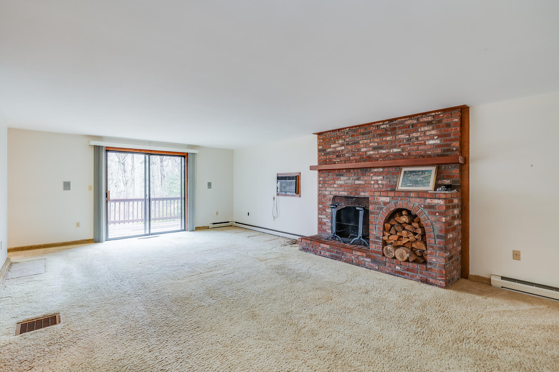 11 Menemsha Way East Falmouth, MA 02536 - Photo 22 of 50 an empty room with windows and fireplace