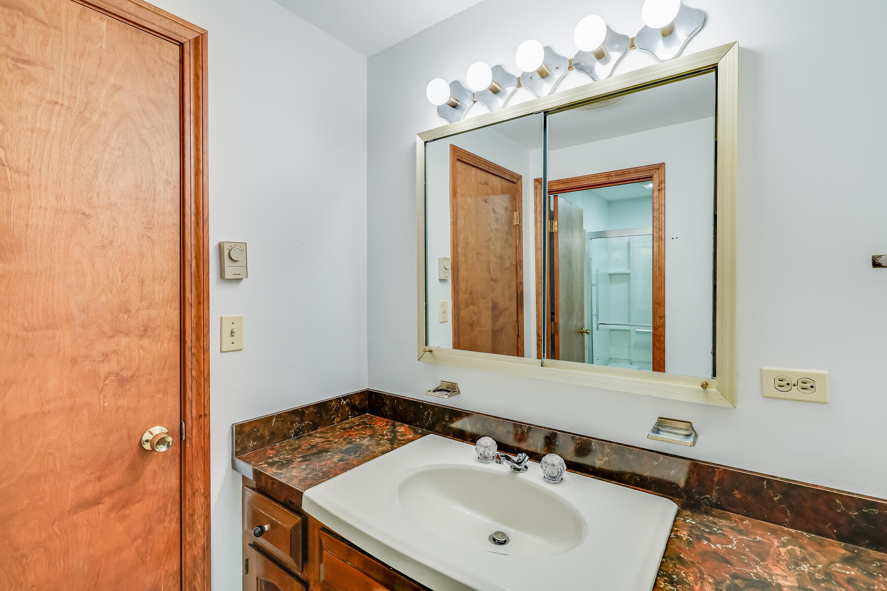 11 Menemsha Way East Falmouth, MA 02536 - Photo 29 of 50 a bathroom with a sink and a mirror
