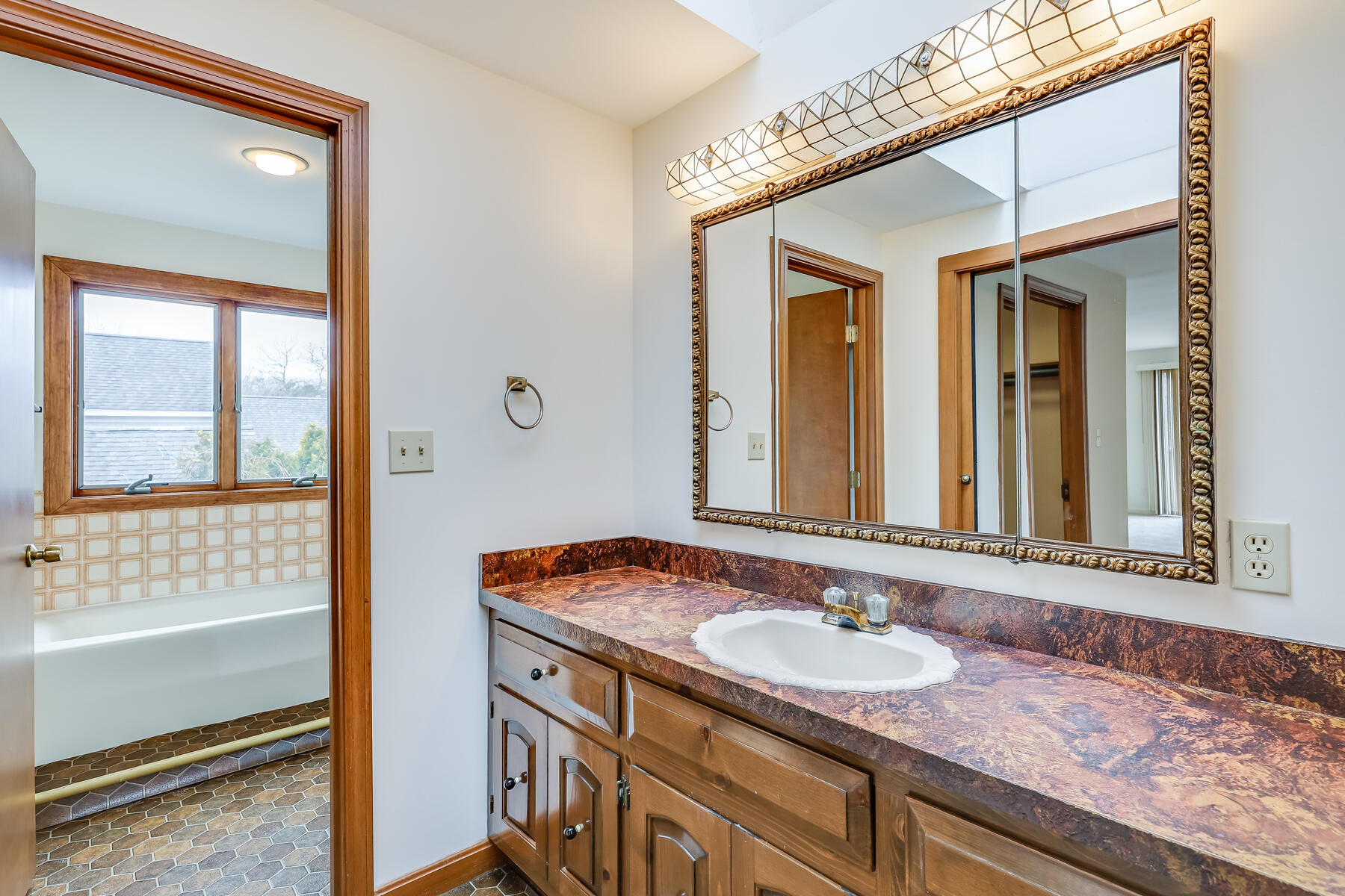 11 Menemsha Way East Falmouth, MA 02536 - Photo 38 of 50 a bathroom with a granite countertop sink and a mirror