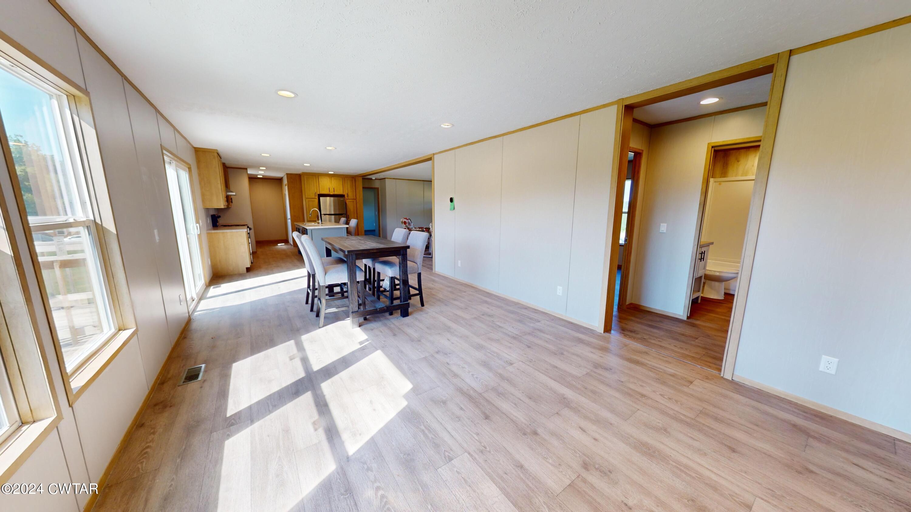 463 Peckerwood Point Road Newbern, TN 38059 - Photo 11 of 35 a view of a livingroom with furniture window and wooden floor